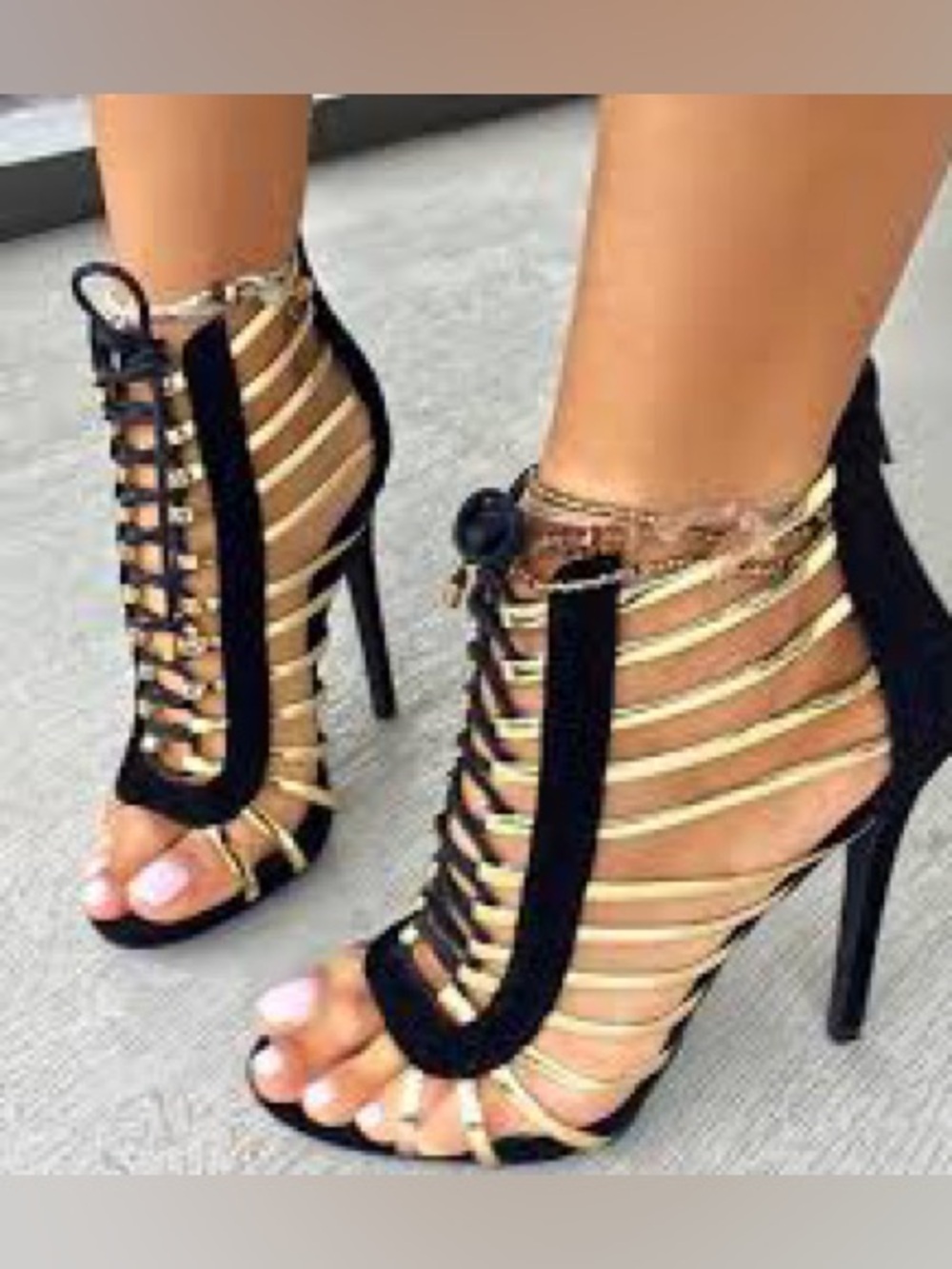 Ralph Lauren "Skyla" strappy heels in black and gold.